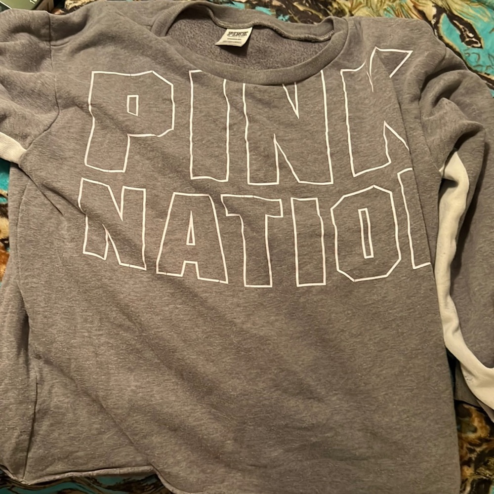 A pink grey sweater